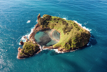 Aerial view of one of the beautiful Azores islands on a sunny day