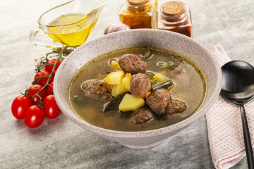 Soup with meatball and potato