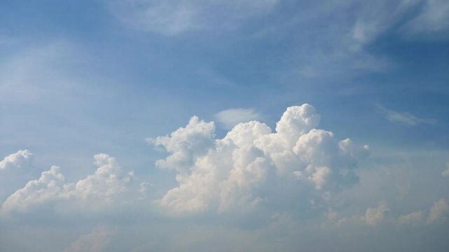 Time lapse clouds, rolling puffy clouds are moving, white clouds time lapse. Clouds running across the blue sky. 4k Timelapse of white clouds with blue sky in background.