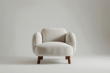 This retro cream-colored armchair boasts wide padded arms and a cushioned seat, presenting a blend of nostalgia and comfort that easily complements contemporary or vintage decor.