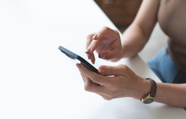 Close up of woman hand using mobile smart phone for online shopping and digital banking via mobile app, surfing the internet, social media network, people lifestyle