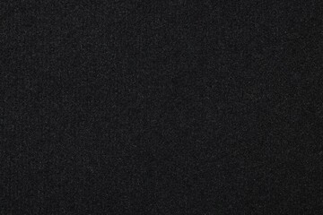 Black car mat as background, closeup view
