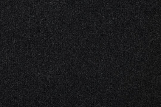 Black car mat as background, closeup view