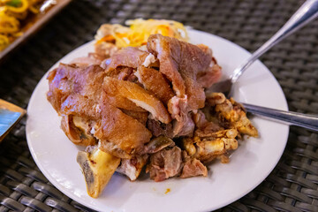 Filipino food: a plate of delicious crispy pasta, deep fried pork knuckles