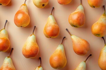 An eye-catching collection of ripe pears scattered on a light background, showcasing their natural texture, orange and green tones, and inviting appearance.