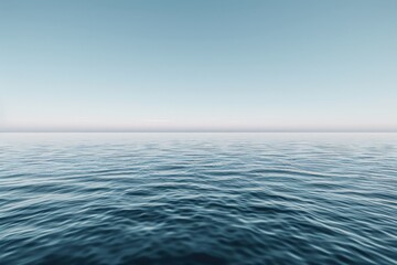 Obraz premium An expansive view of the ocean, stretching infinitely under a clear, blue sky. The water is calm and serene, creating a sense of peace and endless possibility.