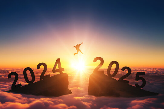 Happy new year 2025, Silhouette Man jumping from 2024 cliff to 2025 cliff on sky background. Сoncept of moving from year to year. New Year's concept.