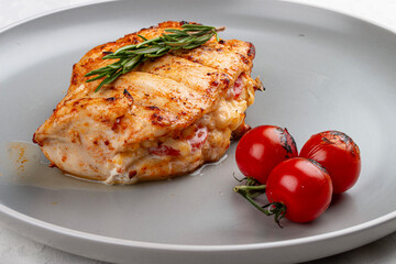 Grilled chicken breast with rosemary and cherry tomatoes