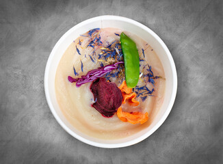 Celery root puree soup. Healthy diet. Takeaway food. Ecological packaging. Top view, on a gray background.