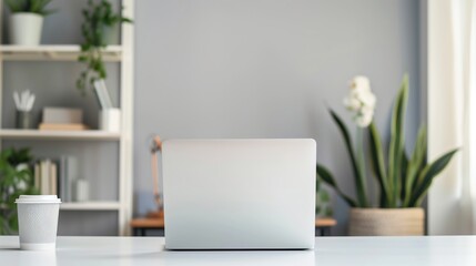 Fototapeta premium Modern workspace setup with a laptop, Ideal for illustrating productivity and minimalism in a professional setting
