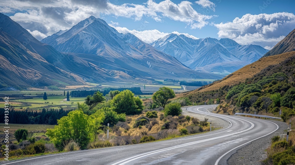 Poster a mountain road with sharp curves and scenic views of valleys and peaks