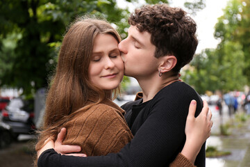 Obraz premium International dating. Lovely young couple spending time together outdoors