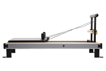 A Modern Pilates Reformer Awaits, Ready for Strength and Flexibility on a Clear PNG or White Background.