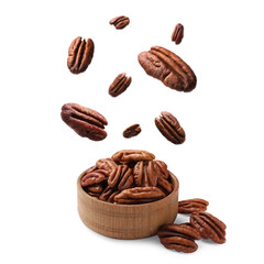 Pecan nuts falling into bowl on white background