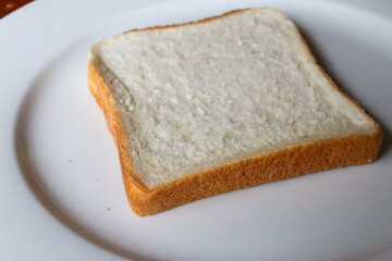 slice of plain white bread on a plate