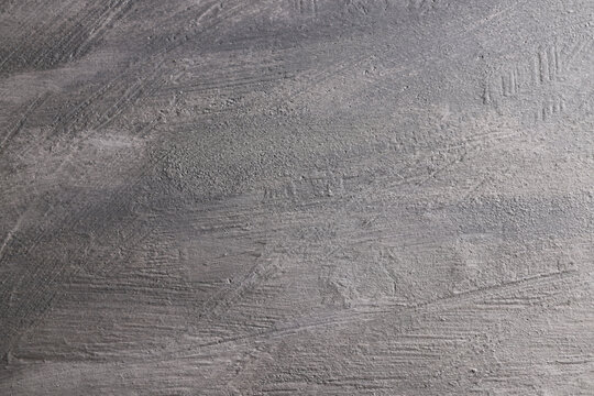 Fondo con texture materica dipinta a tempera di colore grigio; spazio per testo