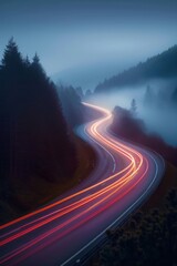 Winding road through fog with light trails at twilight