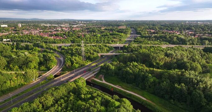 Aerial video of M60 Manchester outer ring road close to junction 5 intersection with princess parkway 