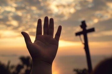 A Hand Reaching for the Divine at Sunset