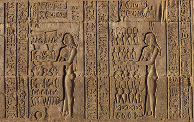 ancient egyptian hieroglyphics on the wall at Kom Ombo temple, Aswan, Egypt