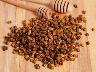 Bee bread heap on table, alternative medicine