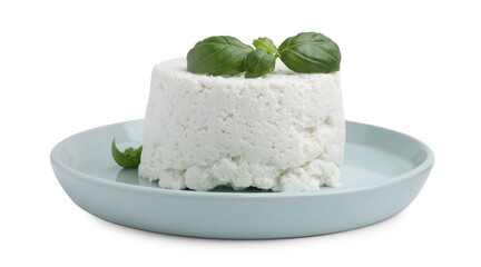 Fresh ricotta (cream cheese) and basil isolated on white