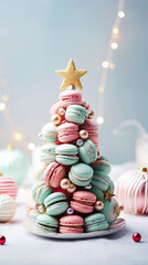 Obraz premium Decorative Christmas tree with sweet macaroons on blue background. Sweet macaroons arranged in a Christmas tree with a star on the top. Vertical.