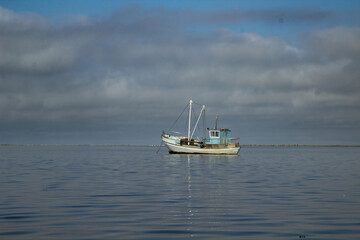 a small old wooden fishing boat