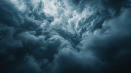 Fototapeta premium This image captures thick dark clouds gathering ominously in the sky, offering a powerful visual representation of impending weather changes and atmospheric drama.