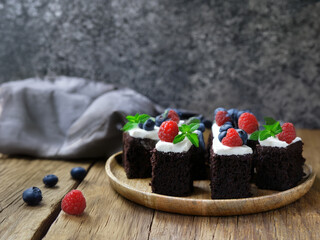 mini brownies with chocolate glaze on a plate