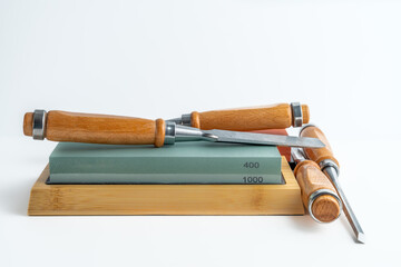 selection of wooden handled  chisels pre sharpening on wetstones