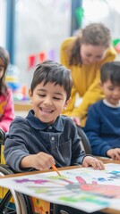 Fototapeta premium Little boy in wheelchair sitting at table in classroom. Elementary school.