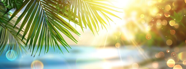 Obraz premium Green palm leaf on tropical sand beach with blurred blue sea with bokeh sun light. Summer vacation and travel concept. Background for card, banner, poster with copy space