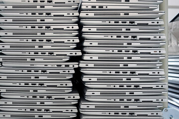 Big stacks of discarded laptops, notebooks on a trolley