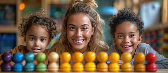 Teacher and Two Students Smile at the Camera