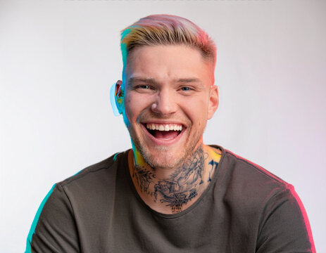 Vibrant Glitch Art of Tattooed Man Giggling in Studio with High-Contrast Effects