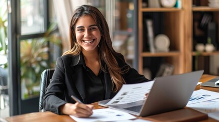 Happy hr manager with resume at desk 
