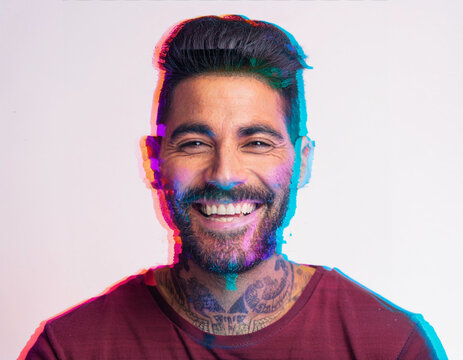 Vibrant Glitch Art of Tattooed Man Giggling in Studio with High-Contrast Effects - Powered by Adobe