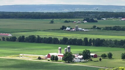 Typical American farm with silos in rural Midwestern USA. Agricultural landscape in United States