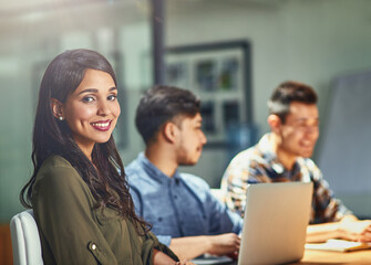 Teamwork, smile and portrait of business woman at desk in office for creative startup company. Face, happy manager and technology for graphic designer, entrepreneur or worker coworking in meeting