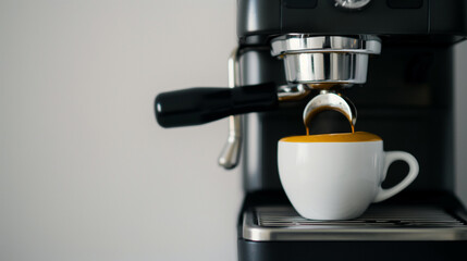 Modern coffee machine making a cup of coffee on bright simple background