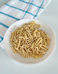 Lorighittas, ancient traditional Sardinian pasta, refined, hand-woven spaghetti made of semolina and water
