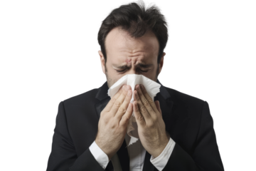 Businessman sneezing into tissue paper, showing illness isolated on white background