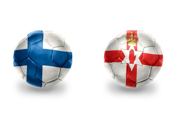 Obraz premium football balls with national flags of northern ireland and finland, soccer teams. on the white background.