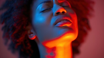 Close-up of a woman wincing in pain while touching her cervical spine area