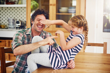 Care, love and father play with child for bonding in kitchen together, excited and laughing as daughter parent. Girl, dad and weekend in home with kid, fun game and happiness for childhood memory