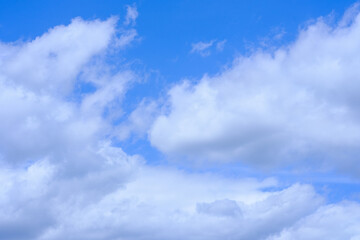 white cumulus clouds on a windy summer day