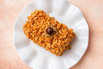 Mocha nougat caramel cake with chocolate chip on top