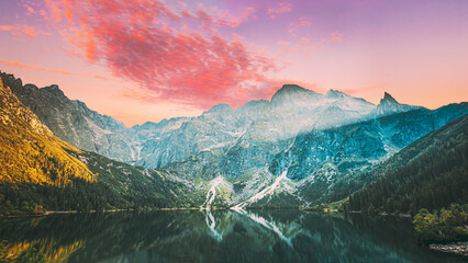 Tatra National Park, Poland. Famous Mountains Lake Morskie Oko Or Sea Eye Lake In Summer Evening. Beautiful Sunset Sunrays Above Tatras Lake Landscape © Great Brut Here