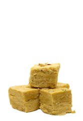 Closeup of Soan Papdi or Shompapri Garnished with Cashew Nut and Saffron Isolate on White Background with Copy Space, Also Known as Patisa or Shonpapdi